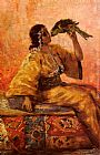 A Moroccan Beauty Holding A Parrot by Frantz Charlet